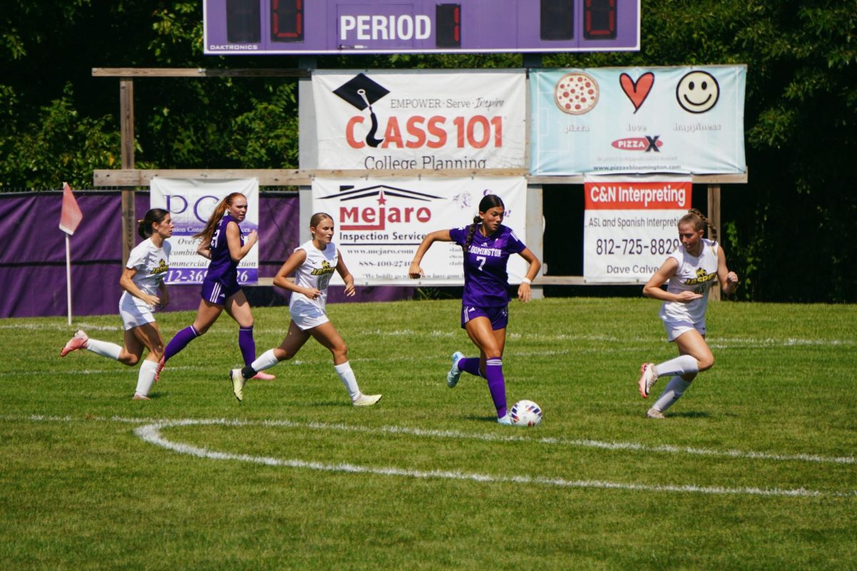 Junior Helena Cutshall drives the ball down the field during the girls soccer home-opener against Jasper.