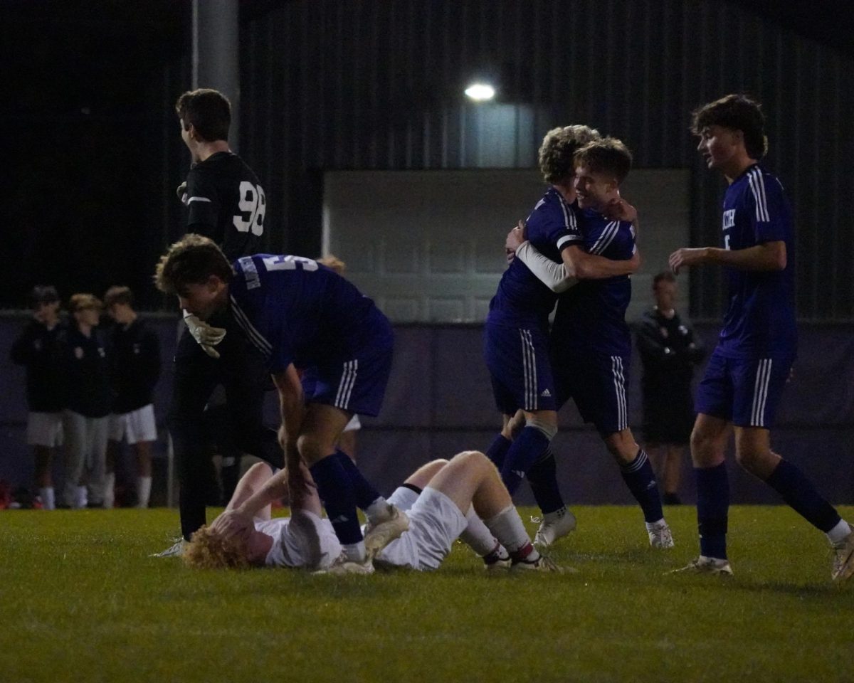 Members of the Bloomington South boys' soccer team celebrate an emotional victory on Thursday after defeating the nations top-ranked Center Grove 2-0, securing their spot in the regional tournament.