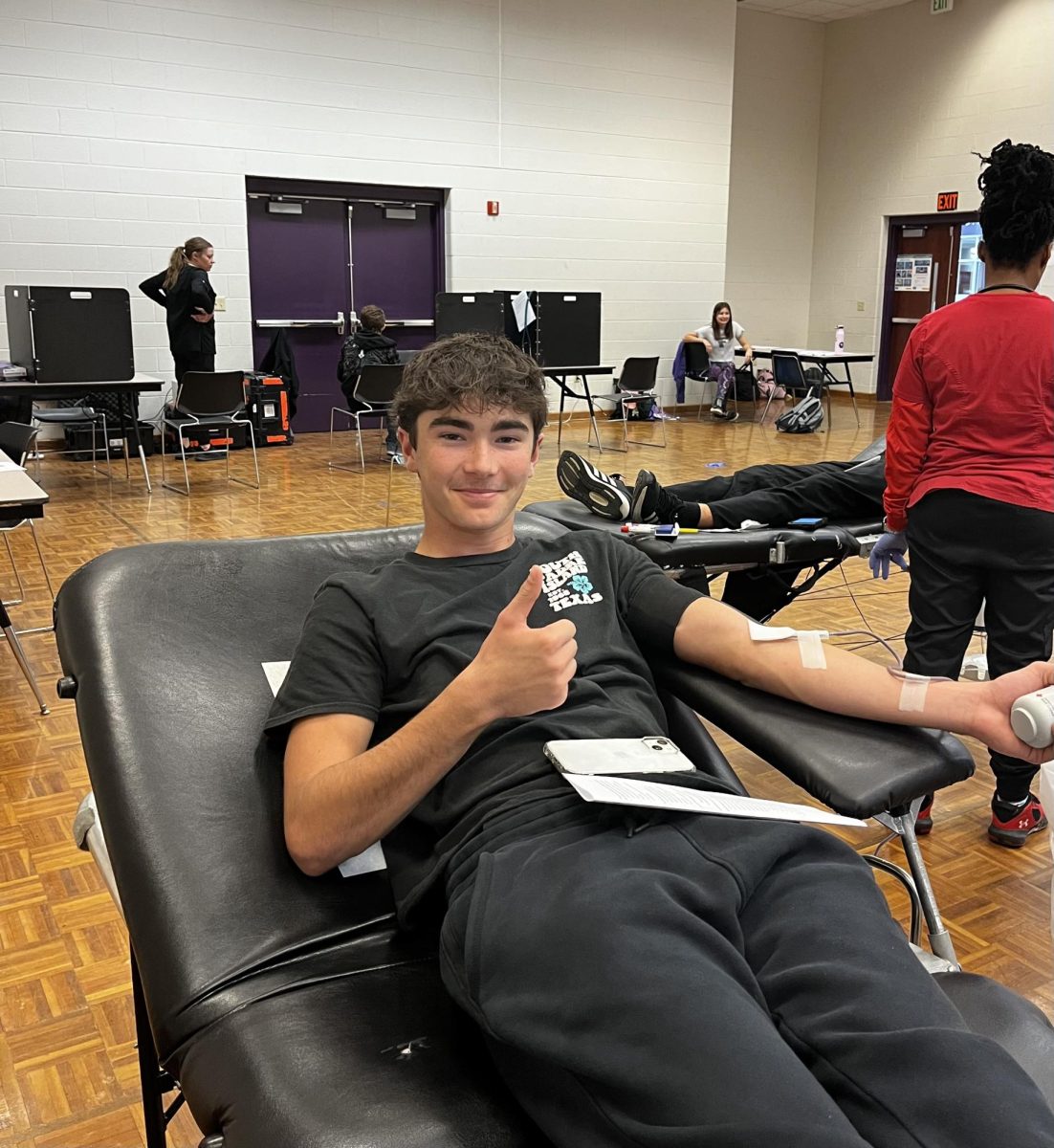 Dominic Swartz gets his blood drawn at Bloomington South’s Red Cross blood drive