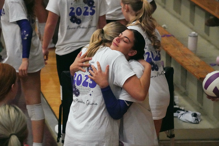 Senior Lake Butiste embraces sophomore Ella Alley at the conclusion of South volleyball's Senior Night celebration on Oct. 10, 2024.