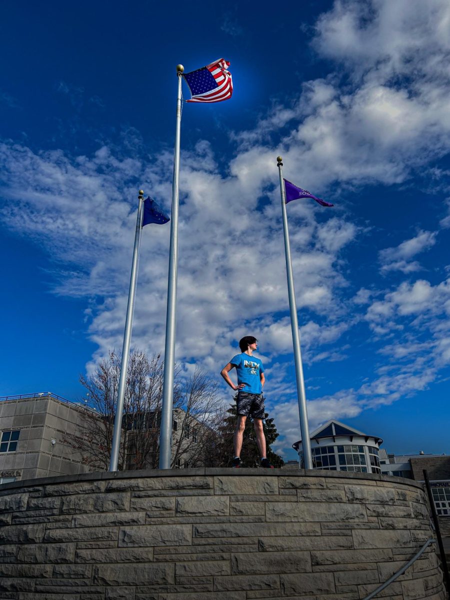 Senior Eric Shaffer standing next to the American flag
Shaffer is proud to live under four more years of Trump
