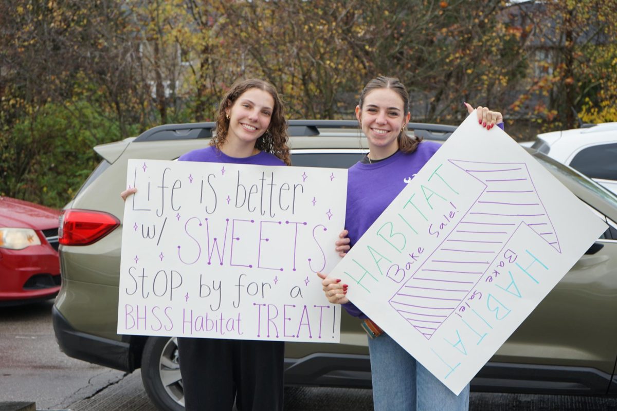 Addison Green and Aubrey Kraft encouraging the Bloomington community to donate