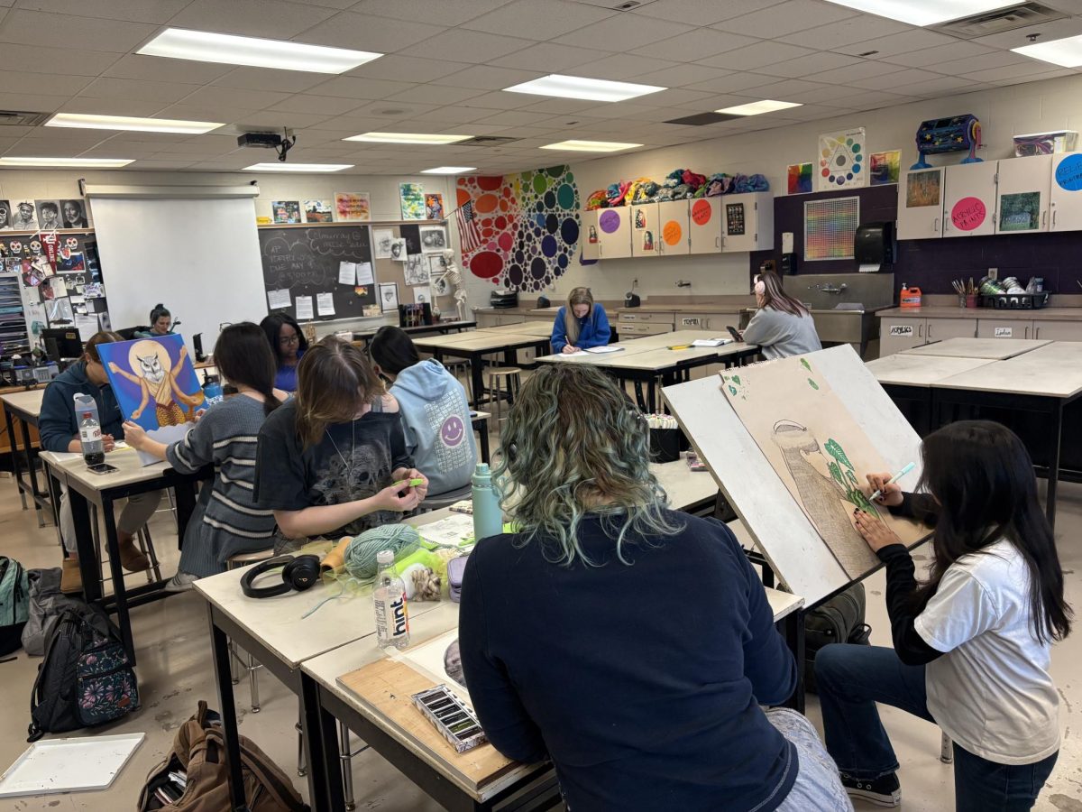 Students in AP art work on their art portfolios