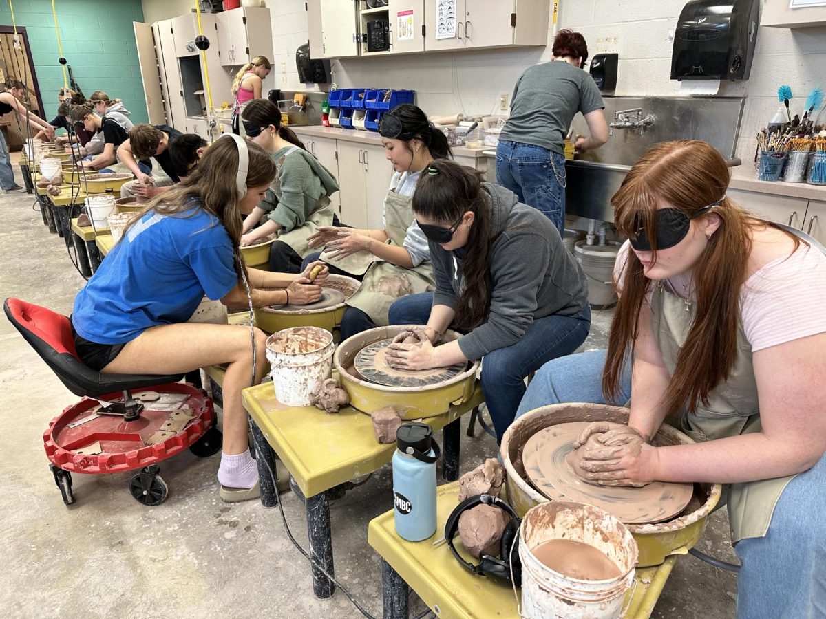 Students in ceramics work blindfolded